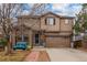 Charming two-story home with a two-car garage, lovely landscaping, and a welcoming entryway at 6193 Brantly Ave, Castle Rock, CO 80104