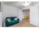 Comfortable living space with a green sofa, neutral walls, and ample natural light at 6193 Brantly Ave, Castle Rock, CO 80104