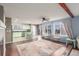 Living room is adjacent to the kitchen which boasts stainless appliances and light green cabinetry at 6193 Brantly Ave, Castle Rock, CO 80104