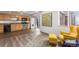 Open-concept living space featuring the kitchen, dining area, and living room with modern decor at 6193 Brantly Ave, Castle Rock, CO 80104