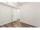 Room with vinyl floors, light walls, white trim, and standard door at 6193 Brantly Ave, Castle Rock, CO 80104