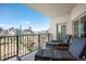 Relaxing balcony with lounge chairs offering stunning downtown cityscape views at 300 W 11Th Ave # 15F, Denver, CO 80204