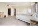 Bright main bedroom features neutral decor, walk-in closet, and balcony access at 300 W 11Th Ave # 15F, Denver, CO 80204