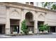 Elegant condo building entrance featuring classic architectural details and manicured landscaping at 300 W 11Th Ave # 15F, Denver, CO 80204