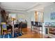 Dining area with hardwood floors, bar seating, and a wine rack at 300 W 11Th Ave # 15F, Denver, CO 80204