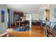 Elegant dining area with hardwood floors, a large table, and a view into the kitchen at 300 W 11Th Ave # 15F, Denver, CO 80204