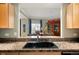 Open-concept kitchen view leading to the dining area with city views at 300 W 11Th Ave # 15F, Denver, CO 80204