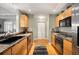 Well-lit kitchen with modern appliances, granite countertops, and hardwood floors at 300 W 11Th Ave # 15F, Denver, CO 80204