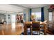 Bright, open-plan living and dining area featuring hardwood floors and large windows with city views at 300 W 11Th Ave # 15F, Denver, CO 80204