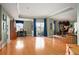 Spacious living room with hardwood floors, a wall of windows, and a dedicated office space at 300 W 11Th Ave # 15F, Denver, CO 80204