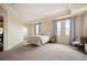 Serene main bedroom with large windows, city views, and neutral tones, creating a relaxing atmosphere at 300 W 11Th Ave # 15F, Denver, CO 80204