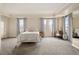 Serene main bedroom with large windows, city views, and neutral tones, with ample natural light at 300 W 11Th Ave # 15F, Denver, CO 80204