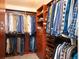 Spacious walk-in closet with custom shelving and ample storage for clothes and shoes at 300 W 11Th Ave # 15F, Denver, CO 80204