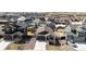 Aerial view of a suburban home with a two-car garage, covered porch, and well-manicured lawn at 929 Honey Berry Ct, Elizabeth, CO 80107