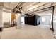 An unfinished basement with exposed ceilings offering great potential for customization at 929 Honey Berry Ct, Elizabeth, CO 80107