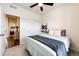 Neutral-toned bedroom featuring a ceiling fan and closet with sliding doors at 929 Honey Berry Ct, Elizabeth, CO 80107