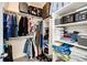 Well-organized closet with shelving for clothes, shoes and luggage at 929 Honey Berry Ct, Elizabeth, CO 80107