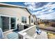 Wooden deck with outdoor rug, BBQ and views of fenced backyard at 929 Honey Berry Ct, Elizabeth, CO 80107