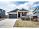 Charming single Gathering home featuring a two-car garage, covered porch, and neutral color palette at 929 Honey Berry Ct, Elizabeth, CO 80107