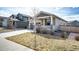 Well-maintained home featuring a two-car garage, covered porch, and tidy front yard landscaping at 929 Honey Berry Ct, Elizabeth, CO 80107