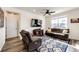 Inviting living room with TV, comfortable seating, and bright natural light at 929 Honey Berry Ct, Elizabeth, CO 80107