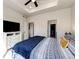 Spacious main bedroom with a tray ceiling, walk-in closet, and natural light at 929 Honey Berry Ct, Elizabeth, CO 80107