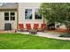 Relaxing backyard featuring comfortable seating around a fire pit and lush green lawn at 1205 W 11Th Ct, Broomfield, CO 80020