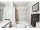Bathroom featuring a shower-tub combo with tile surround and a modern vanity at 1205 W 11Th Ct, Broomfield, CO 80020