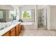 Luxurious bathroom with a soaking tub, separate glass shower, and double sink vanity at 1205 W 11Th Ct, Broomfield, CO 80020