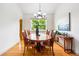 The cozy dining room has a wood table set with six chairs and a decorative plant at 1205 W 11Th Ct, Broomfield, CO 80020
