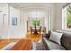 Bright dining room featuring hardwood floors and abundant natural light at 1205 W 11Th Ct, Broomfield, CO 80020