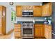 Close-up of the updated kitchen with stainless steel appliances at 1205 W 11Th Ct, Broomfield, CO 80020