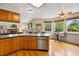 Open concept kitchen with adjacent Gathering room and dining nook at 1205 W 11Th Ct, Broomfield, CO 80020