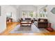 Inviting living room with hardwood floors, large windows, and comfortable seating arrangements at 1205 W 11Th Ct, Broomfield, CO 80020