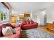 Spacious living room featuring hardwood floors and an open layout connecting to the kitchen area at 1205 W 11Th Ct, Broomfield, CO 80020