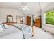 Inviting bedroom with a large window, vaulted ceiling and ample closet space for storage at 1205 W 11Th Ct, Broomfield, CO 80020