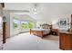 Bright main bedroom featuring a vaulted ceiling, large windows, and ample space for relaxation at 1205 W 11Th Ct, Broomfield, CO 80020