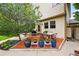 Charming patio space featuring colorful potted plants and an outdoor dining area at 1205 W 11Th Ct, Broomfield, CO 80020