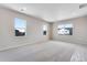Large bedroom with three windows offering lots of natural light and recessed lighting at 10661 Reunion Pkwy, Commerce City, CO 80022