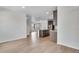 Open floor plan with eat-in kitchen with stainless appliances and a large island at 10661 Reunion Pkwy, Commerce City, CO 80022