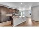 Bright kitchen featuring a large island and stainless steel appliances at 10661 Reunion Pkwy, Commerce City, CO 80022