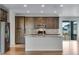 Kitchen island featuring stainless steel appliances and access to outdoor patio at 10661 Reunion Pkwy, Commerce City, CO 80022