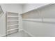Walk-in closet with shelving and clothing racks for ample storage at 10661 Reunion Pkwy, Commerce City, CO 80022