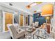 Inviting living room with recessed lighting, plush seating, and elegant decor at 1182 S Alcott St, Denver, CO 80219