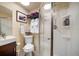 Bathroom featuring glass shower, toilet, sink and towel racks at 1575 York Gulch Rd, Idaho Springs, CO 80452