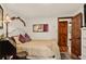 Relaxing bedroom featuring hardwood floors, soft lighting and a comfortable bed at 1575 York Gulch Rd, Idaho Springs, CO 80452