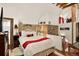 Bright bedroom features high ceilings, wood accents, and a cozy reading nook by a window at 1575 York Gulch Rd, Idaho Springs, CO 80452