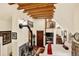 Charming bedroom with exposed wood beams, a fireplace, and natural light from the windows at 1575 York Gulch Rd, Idaho Springs, CO 80452