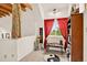 Bright bonus room with a window, bookshelf, and view of the outdoors at 1575 York Gulch Rd, Idaho Springs, CO 80452