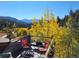 Deck boasts forest views and a fire pit with comfortable seating at 1575 York Gulch Rd, Idaho Springs, CO 80452
